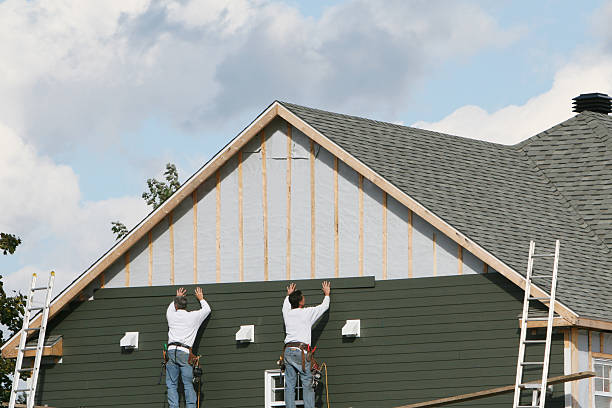 Professional Storm Damage Siding Repair technician working in Falmouth, KY